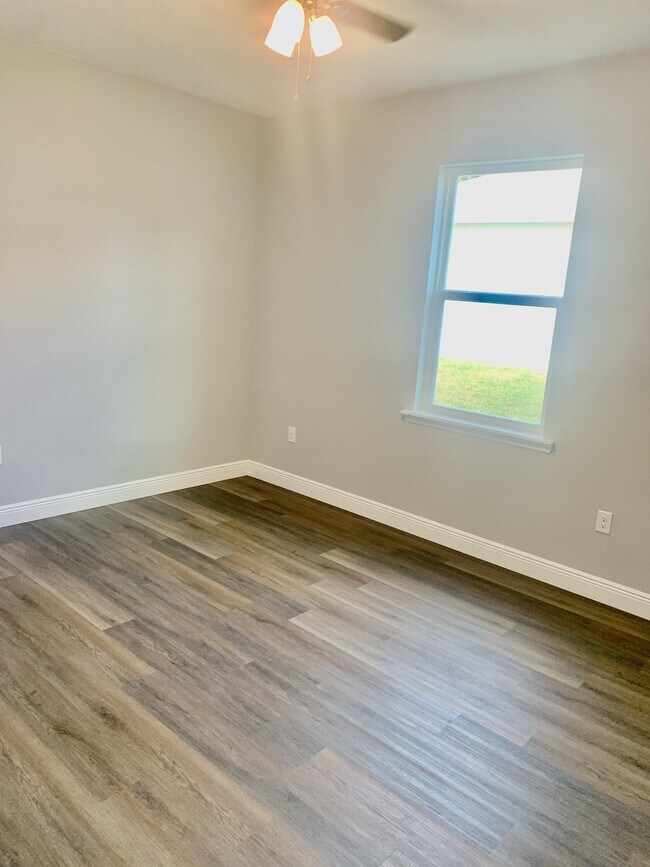Building Photo - "Spacious 4-Bedroom 3-Bath with In-Law Suite & Granite Finishes in Palm Bay!"