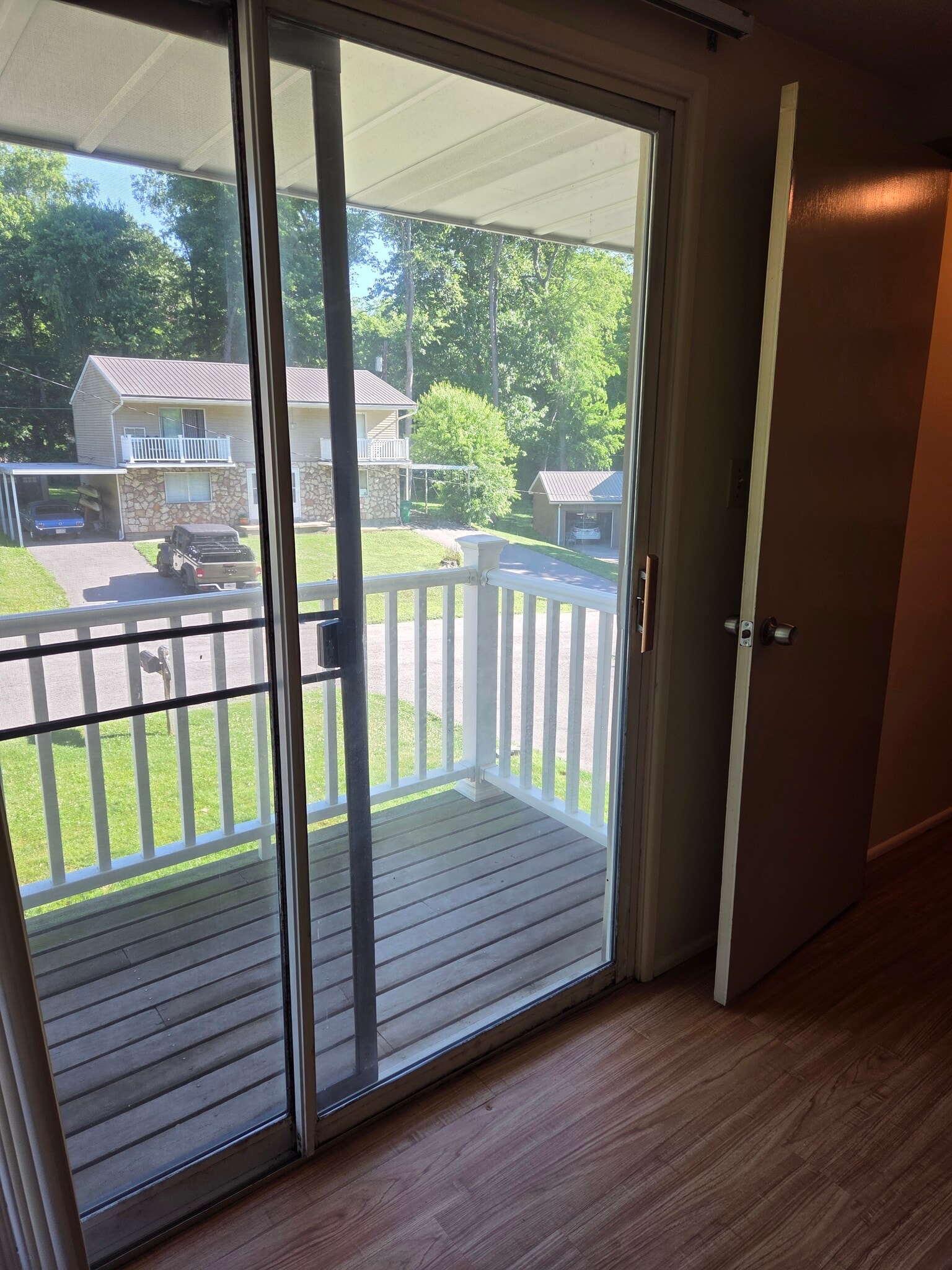 Sliding door in master bedroom opens to balcony overlooking the front yard. - 102 Stonecrest