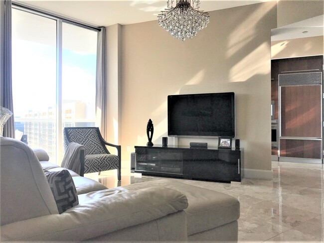 Living Room with crystal chandeliers - 15901 Collins Ave