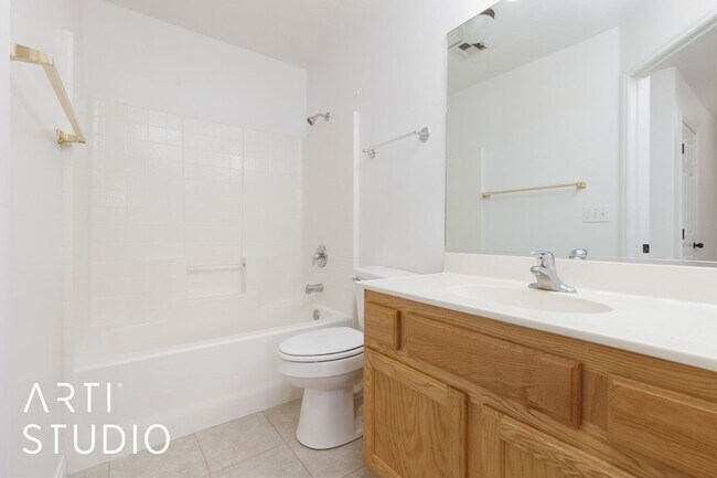 Building Photo - 3-bedroom 2-bathroom townhouse with a 1-ca...