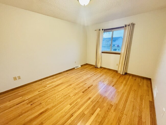 Building Photo - "Charming 4-Bedroom Home with Granite Elegance & Hardwood Warmth in Savage!"