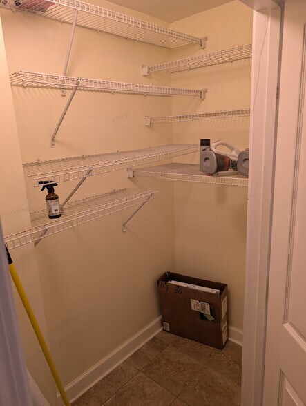 pantry in kitchen with stacked washer & dryer - 1101 Juniper St NE