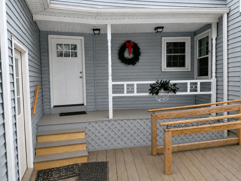 Entrance and porch for the studio apartment. (AI removed the snow) - 217 Bigelow Hill Rd