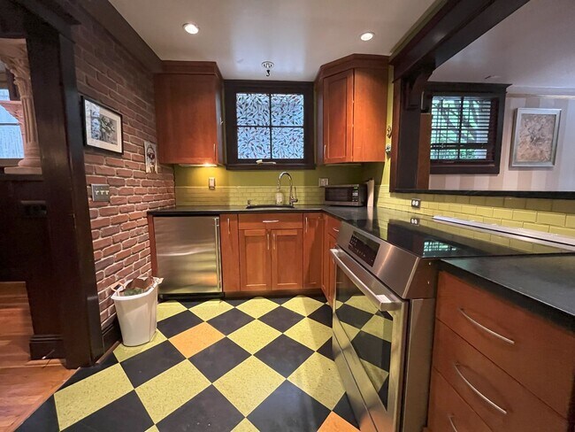 Building Photo - Charming NW Portland 1-Bedroom with Brick Accents & Modern Touches
