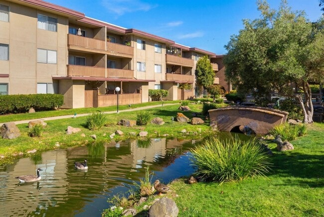 Building Photo - Modern 2-Bedroom Condo with Pool and Koi Pond Views