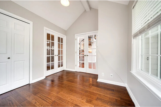 View of French doors in 2nd bedroom/nursery/office with entry to master and to living area - 129 Cherry Hill Dr