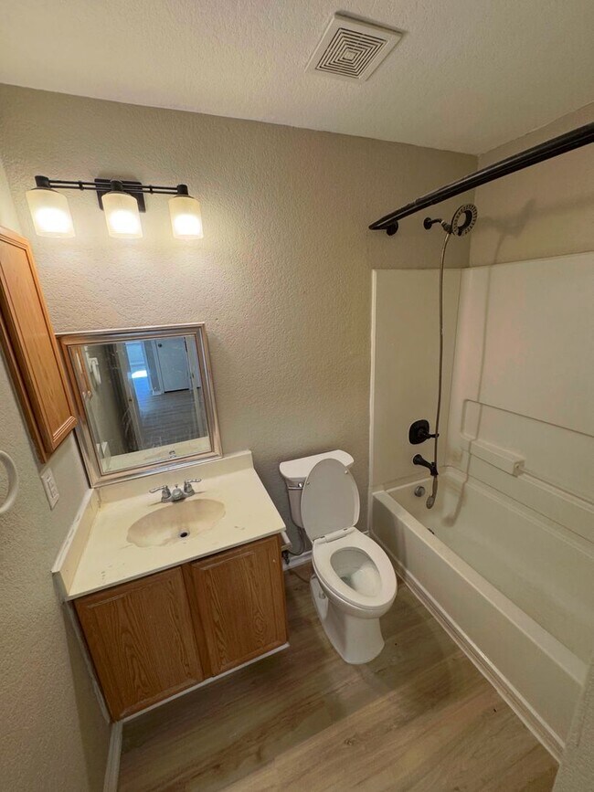 Building Photo - NEW PAINT, FLOORING, APPLIANCES & ROOF  | ...