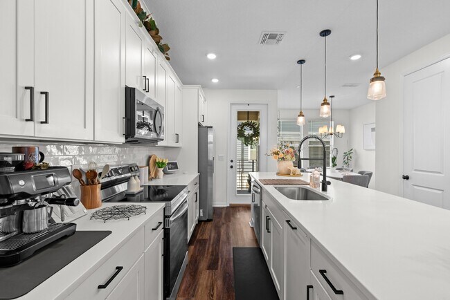 Building Photo - Upgraded 3BR/3.5BA Laureate Park Townhome | 2-Car Garage + EV Charging