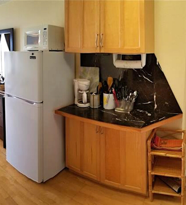 Kitchen area w big fridge - 445 Seaside Ave