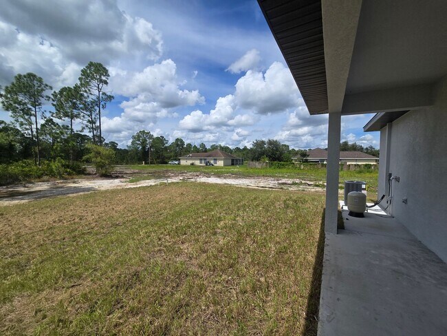 Building Photo - Brand New 2/2/1-South Lehigh Acres