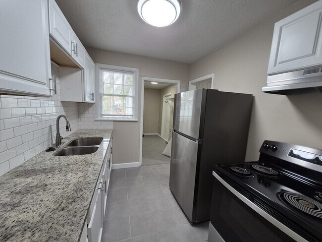 Building Photo - Spacious 4-Bedroom Home with Detached Gara...