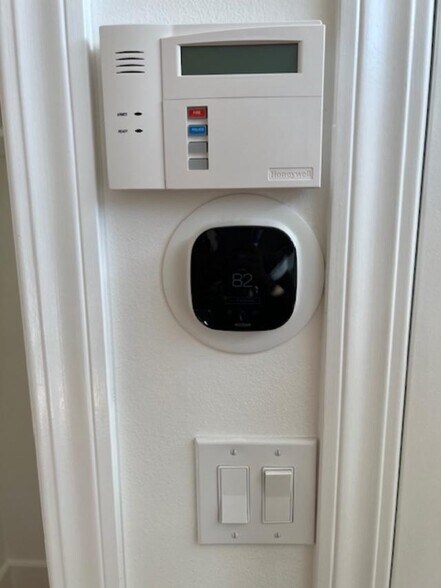 Smart thermostat and alarm system control pad - 2812 Anchor Ave