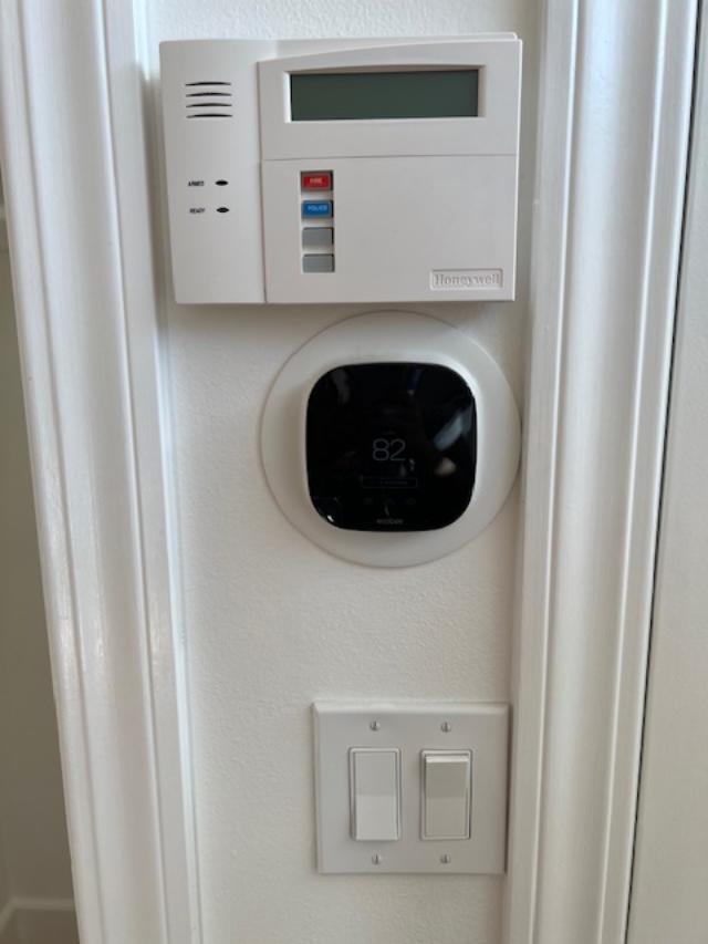 Smart thermostat and alarm system control pad - 2812 Anchor Ave