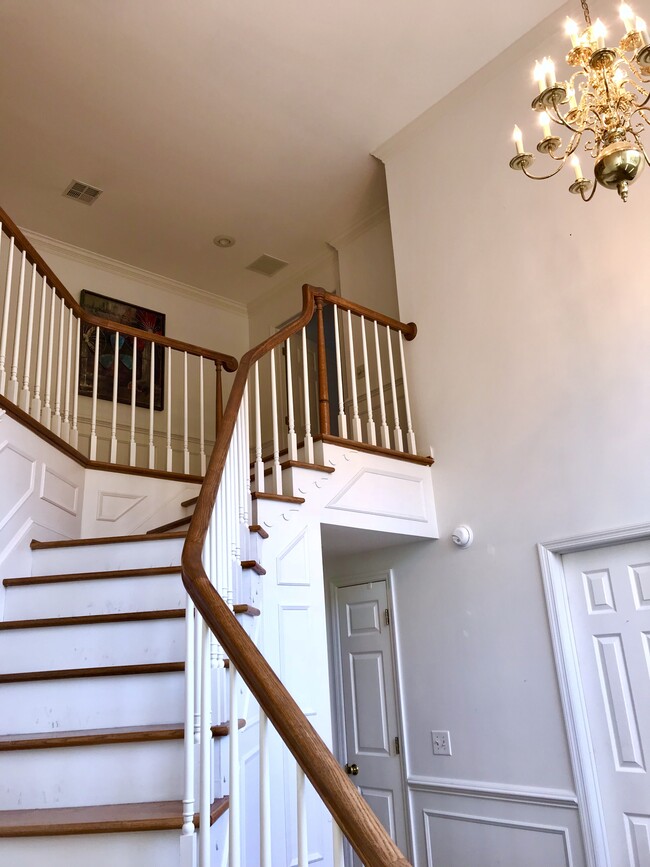 Hallway and staircase to second floor - 141 Players Ct