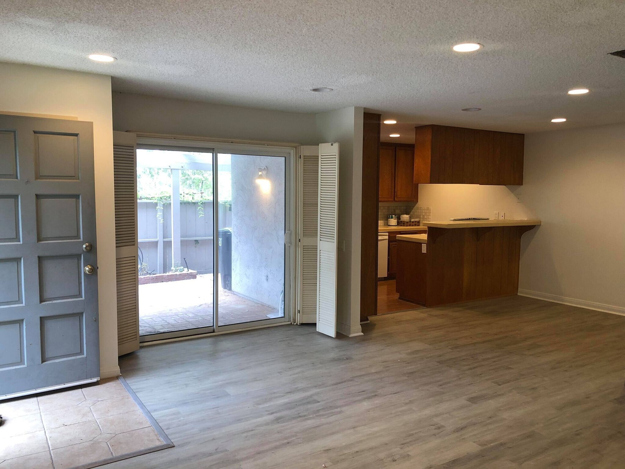 Living area, facing patio backyard access and kitchen (kitchen has been remodeled) - 9594 Easter Way