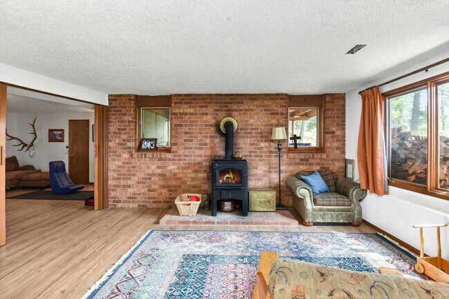 Building Photo - 2700 + sq ft family home has it all! Over 2 acres of land and a stunning view of Lake Pend Oreille