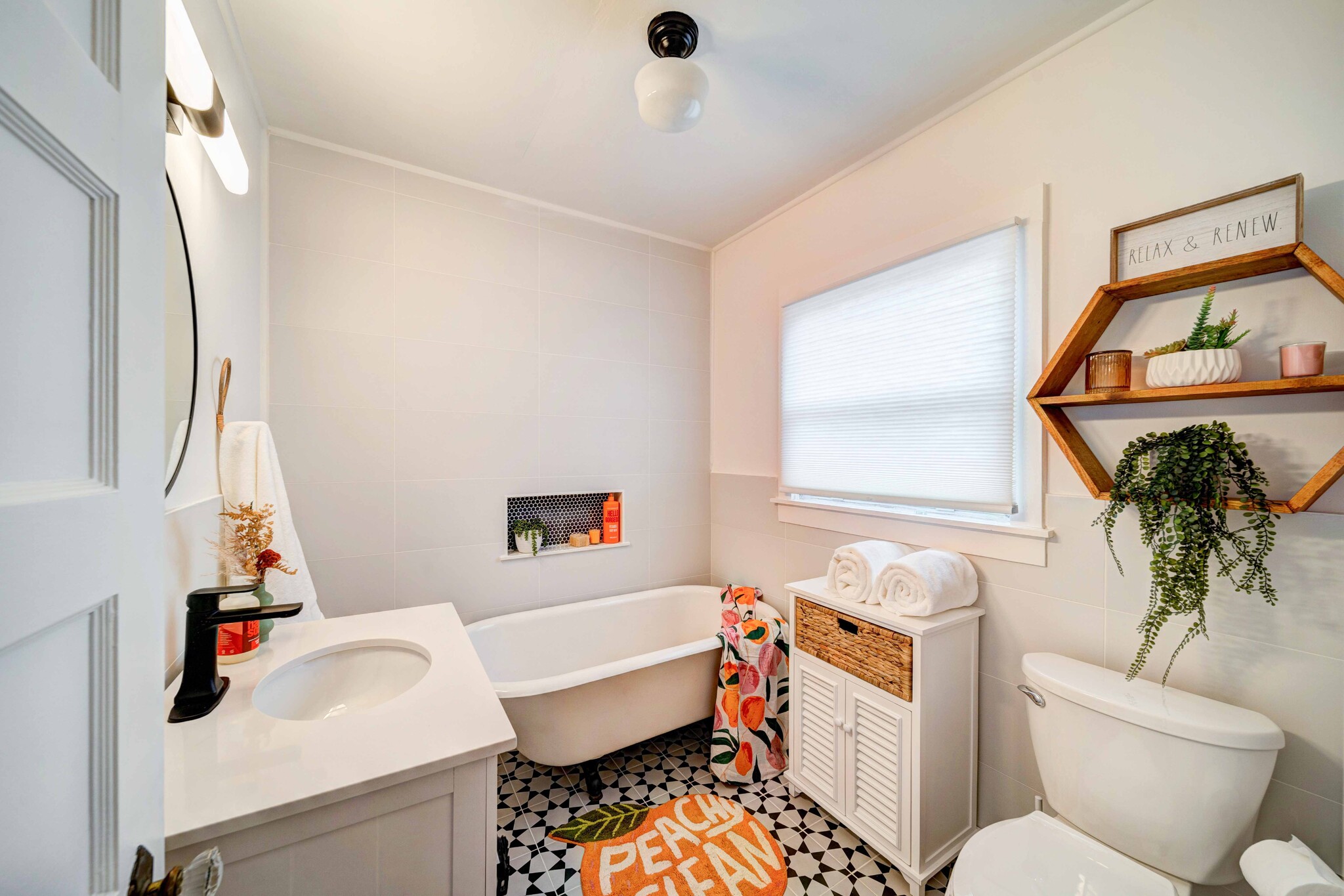 claw foot tub and shower in bathroom - 1229 Orange Ave