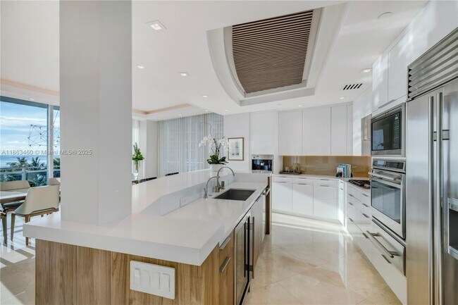 Building Photo - 10295 Collins Ave