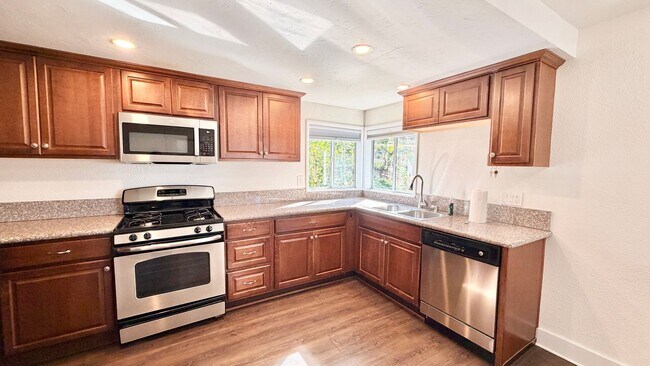 Building Photo - Beautiful Craftsman-style Home with fenced yard space, detached garage and additional parking in ...