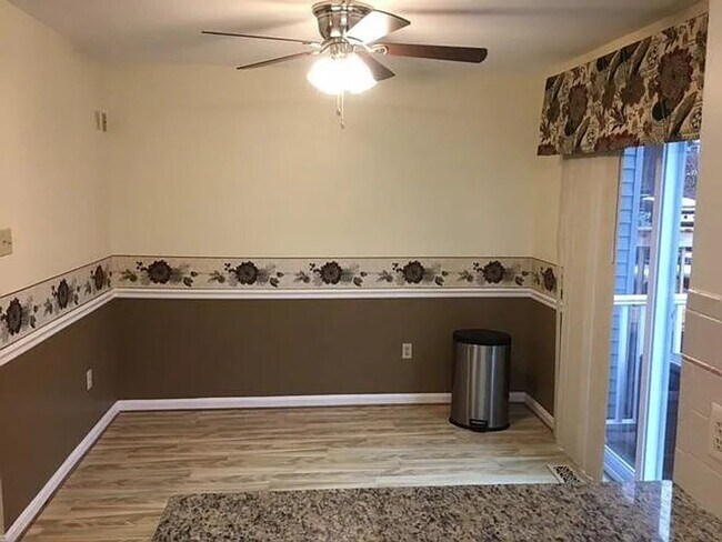 Building Photo - Spacious 3BR Townhome with Walkout Basement, Deck, Fenced Yard, Central A/C + Assigned Parking