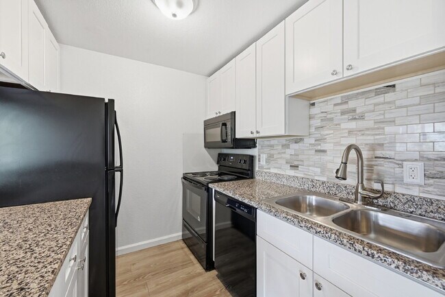 Building Photo - $1,440.95 with $300 Off the first month's rent,  2 Beds - 1 Bath, Condo in Denver with Granite Co...