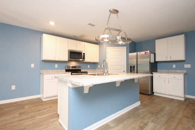 Building Photo - Spacious 5-Bedroom Home Near NAS with Move...