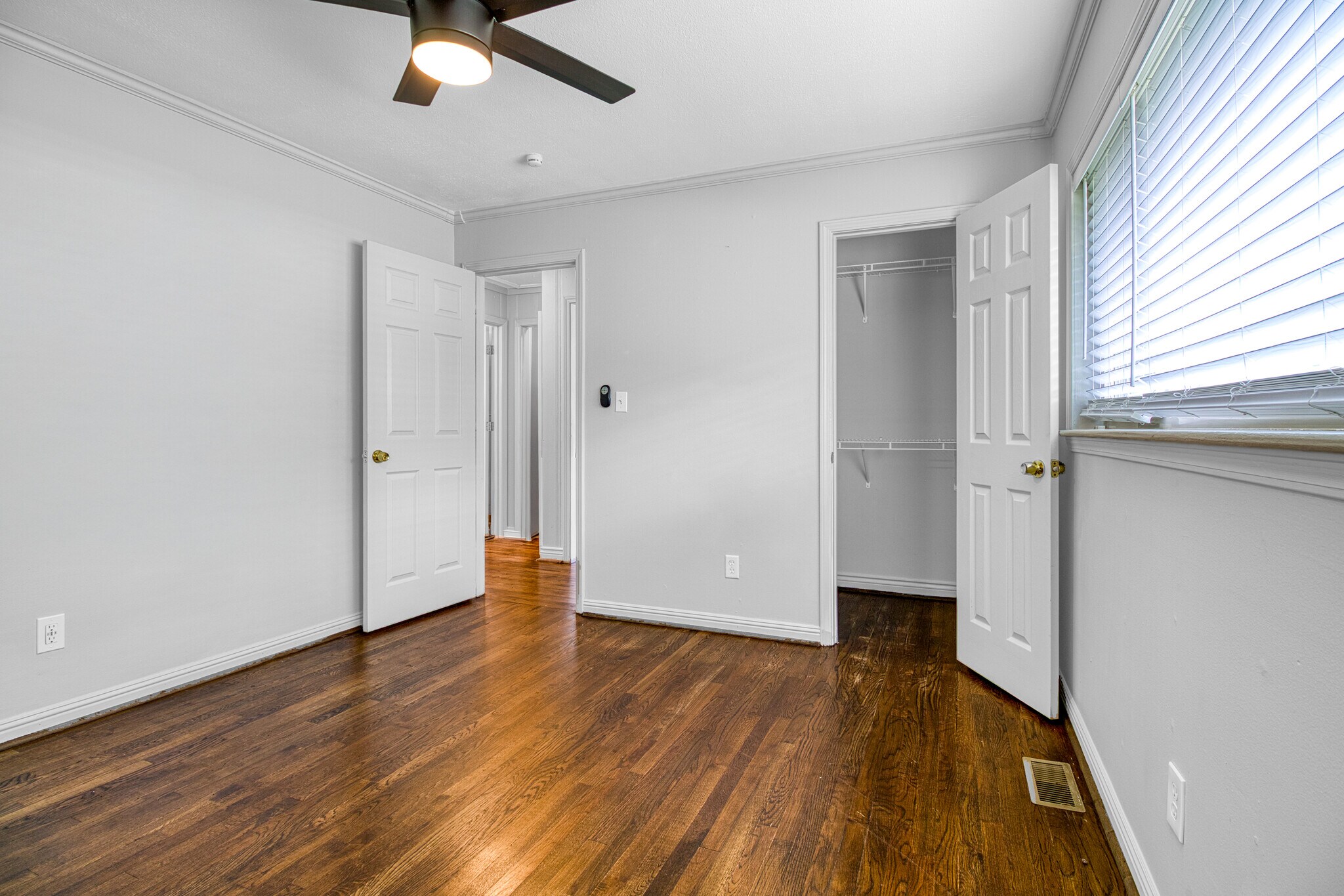 Bedroom (front) with storage & ceiling fan - 3447 Pierce St