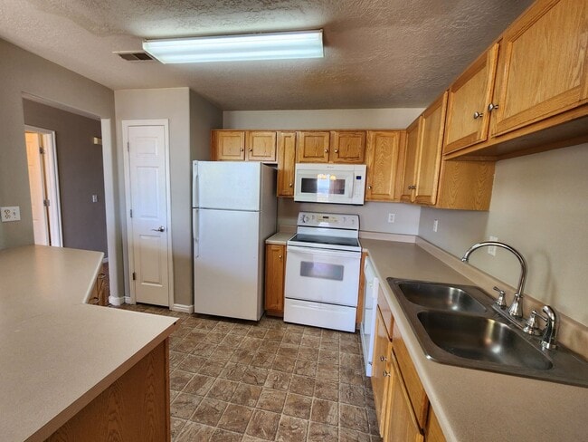 Building Photo - PRICE DROP! 3 bdrm 1.5 bath townhome! You'll love our giant DECK!