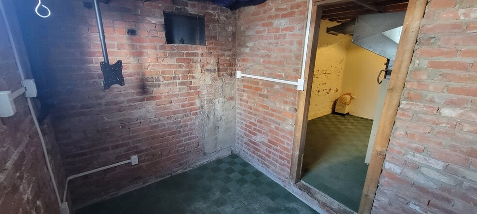Lower level "bonus" space that can be used as a wine cellar, TV room, or meditation area. - 814 Atchison Ave