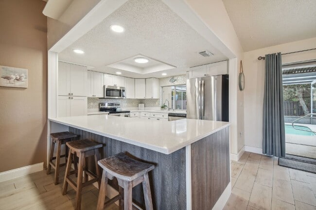 Building Photo - ***PRIVATE HEATED POOL*** Beautiful, Fully-Furnished 3-Bedroom Home Available April 1, 2026!   **...