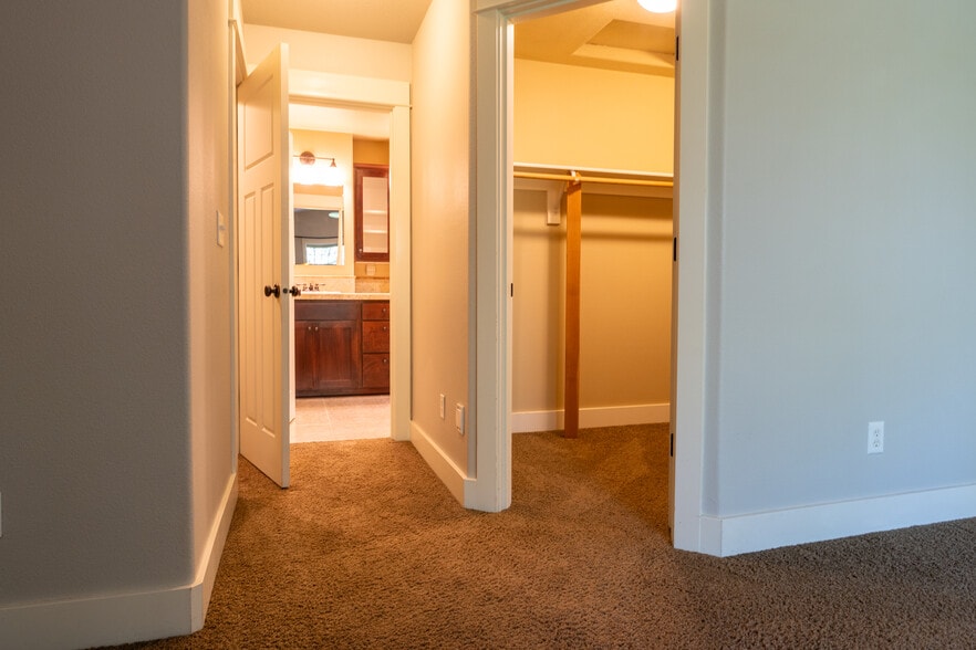Primary bath and walk in closet entrances - 7921 N Denver Avenue