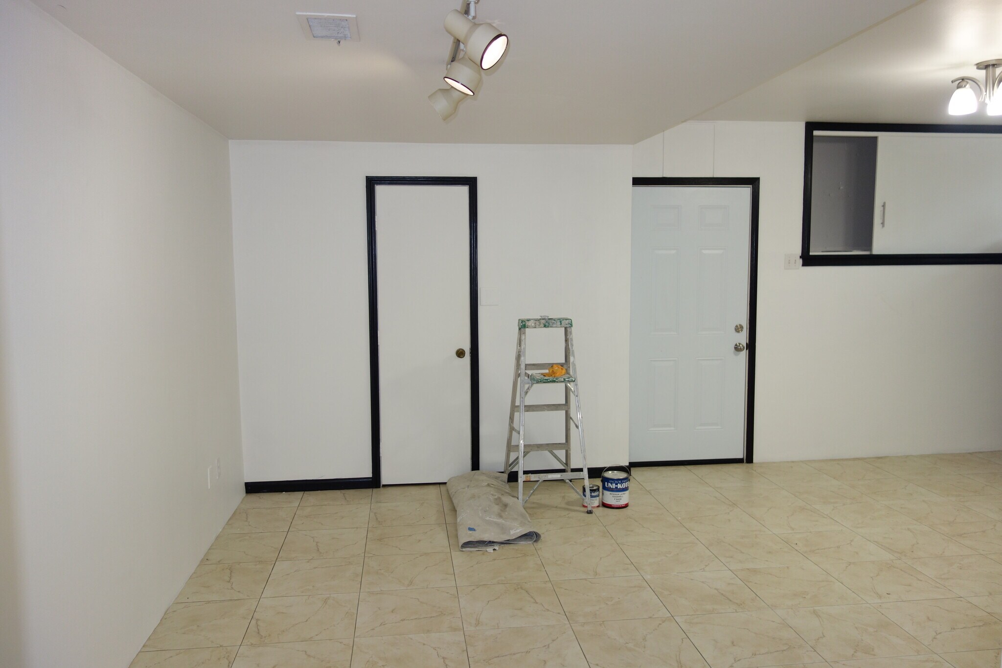 dining area of the kitchen. door on left is a pantry and door on right leads to the one car garage - 1745 S Birmingham Ave