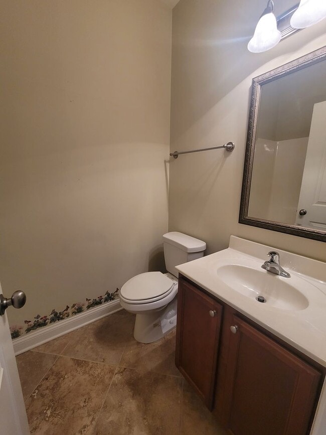 Building Photo - This 3 bedroom 2.5 bath brick townhouse with one car garage is located in Westgate Shoreline subd...