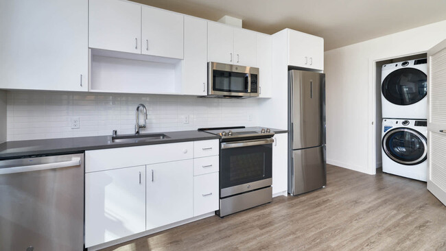 Kitchen with Stainless Steel Appliances and In-home Washer and Dryer - Metro on First