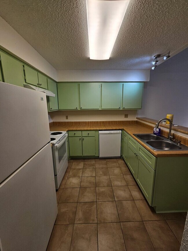 Building Photo - Beautifully Updated 2BR/2BA with Loft Oasis – Safe & Gated Community