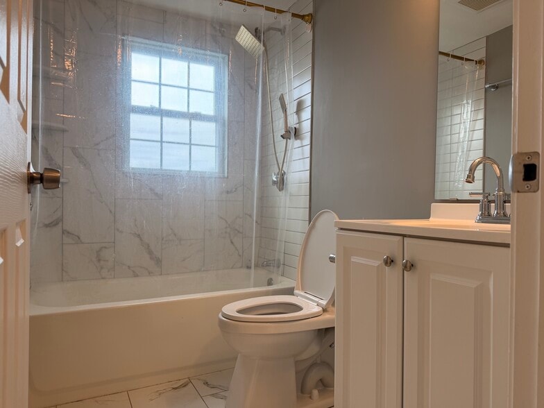 Bathroom with shower and vanity. - 396 Main St