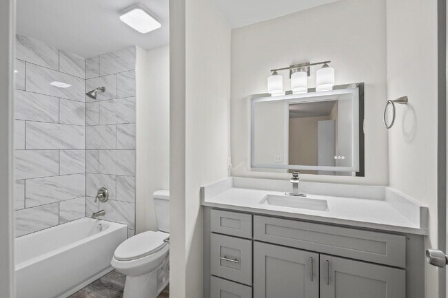 Building Photo - "Charming 2-Bedroom Townhouse Retreat with...