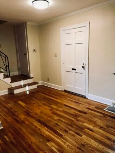 Foyer, stairwell to upstairs, and living room - 1149 Cooper Dr