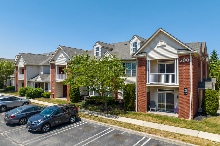 Exterior with parking - Henderson Square Luxury Apartments