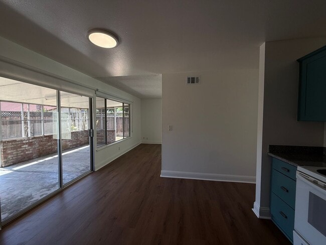 Building Photo - Recently updated home with new floors, paint & bathroom!
