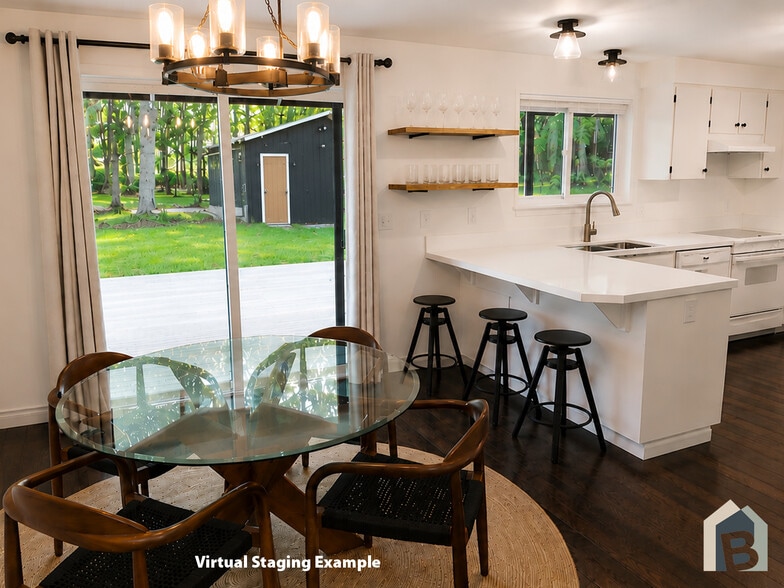 Dining room with glass sliding door to covered large wraparound deck - 20981 Port Gamble Rd NE