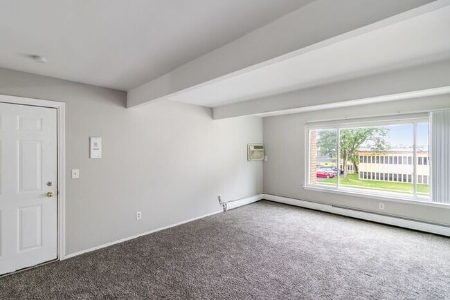 Building Photo - *Beautiful Apartment in Park Like Setting* Updated Shaker Cabinets and Appliances HEAT included