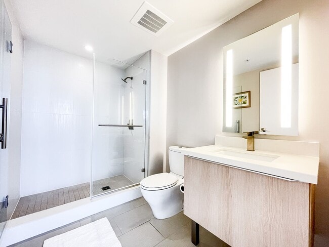 Building Photo - Furnished Symphony Condo with Direct Ocean Views and Two Parking