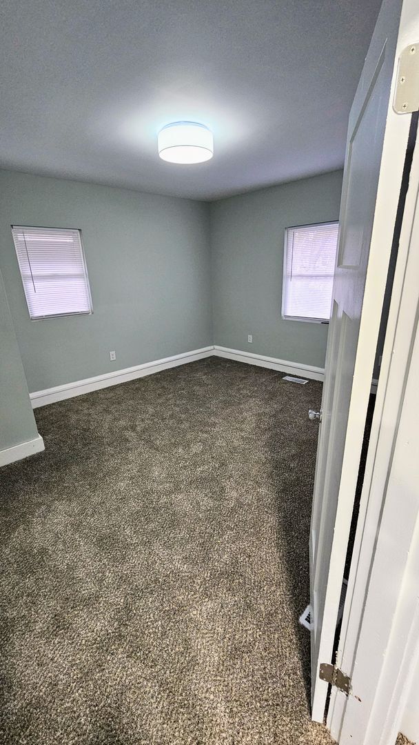 Building Photo - Stunning Renovation Ready for Your Finishing Touches!