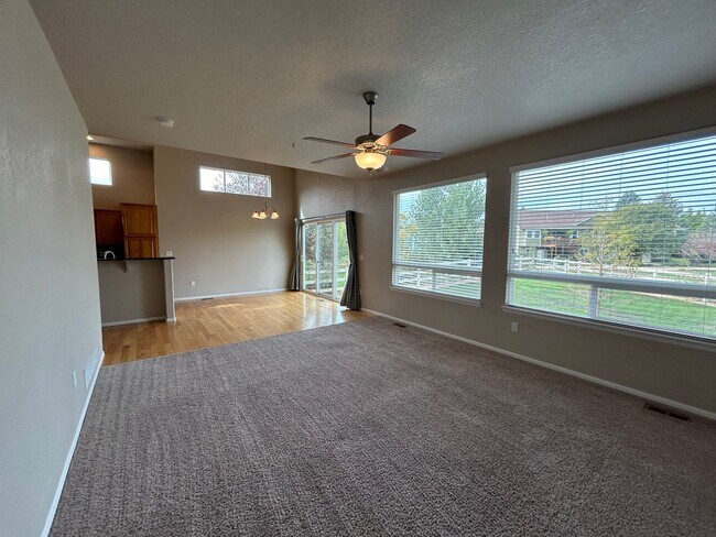 Building Photo - $500 Off First Month Of Rent! Modern 3BR Townhome with Fenced Yard & Garage
