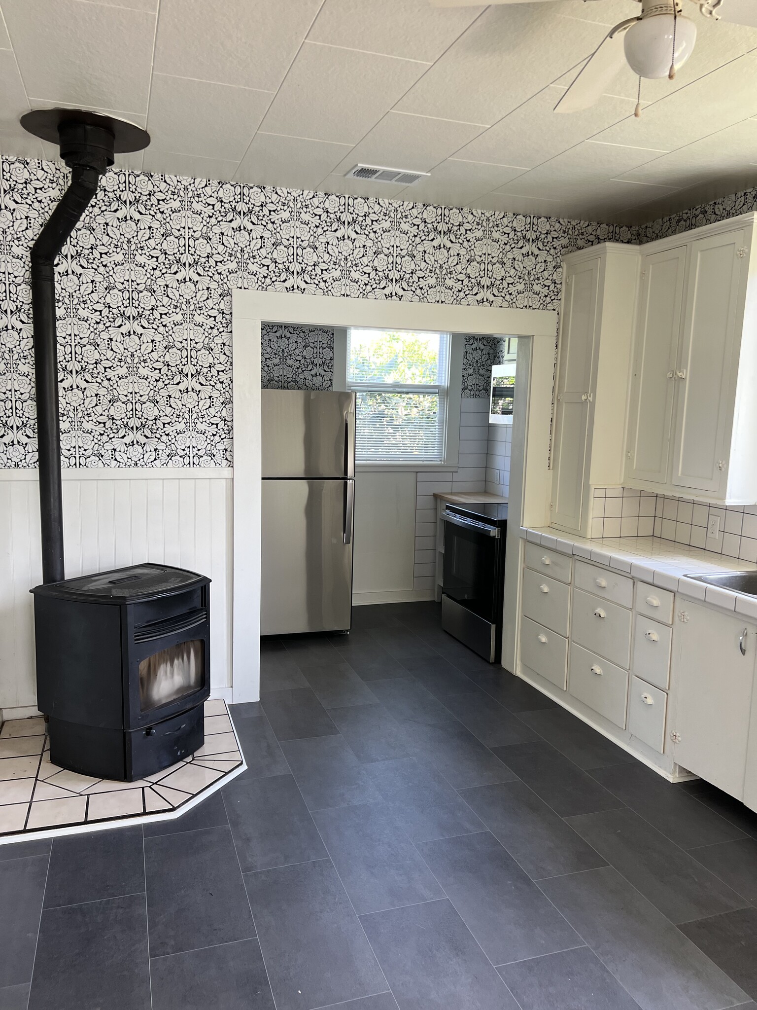 Kitchen with pellet heat stove - 557 Washington St