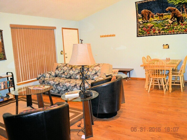 Another view of living area. Has table and 6 chairs. - 24771 Amber Drive