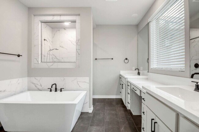 Building Photo - ASK ABOUT FREE APPLICATIONS THROUGH AUGUST!  "Spacious 4-Bedroom Sanctuary with Cozy Fireplace in...