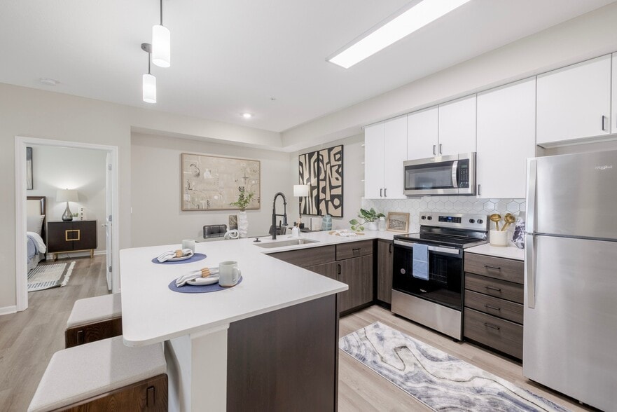 Newly Renovated Kitchen with Stainless Steel Appliances - The Chelsea Apartments