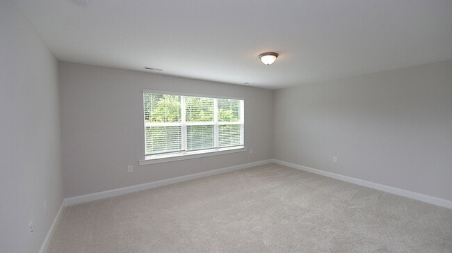Building Photo - Brand New, End Unit Townhome Close to Down...